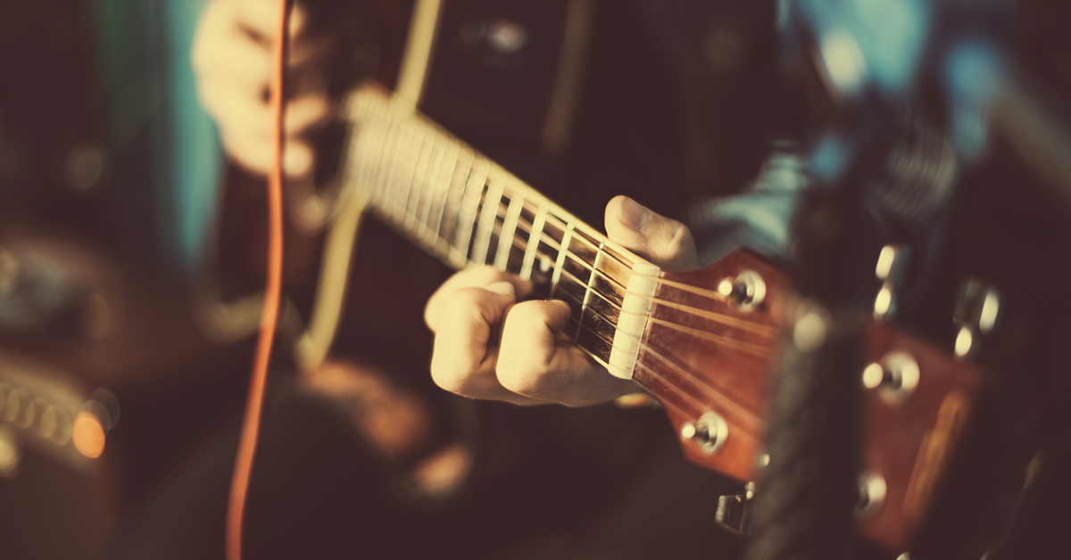 SMC Live Music Graphic 8-22 Close up of man playing guitar