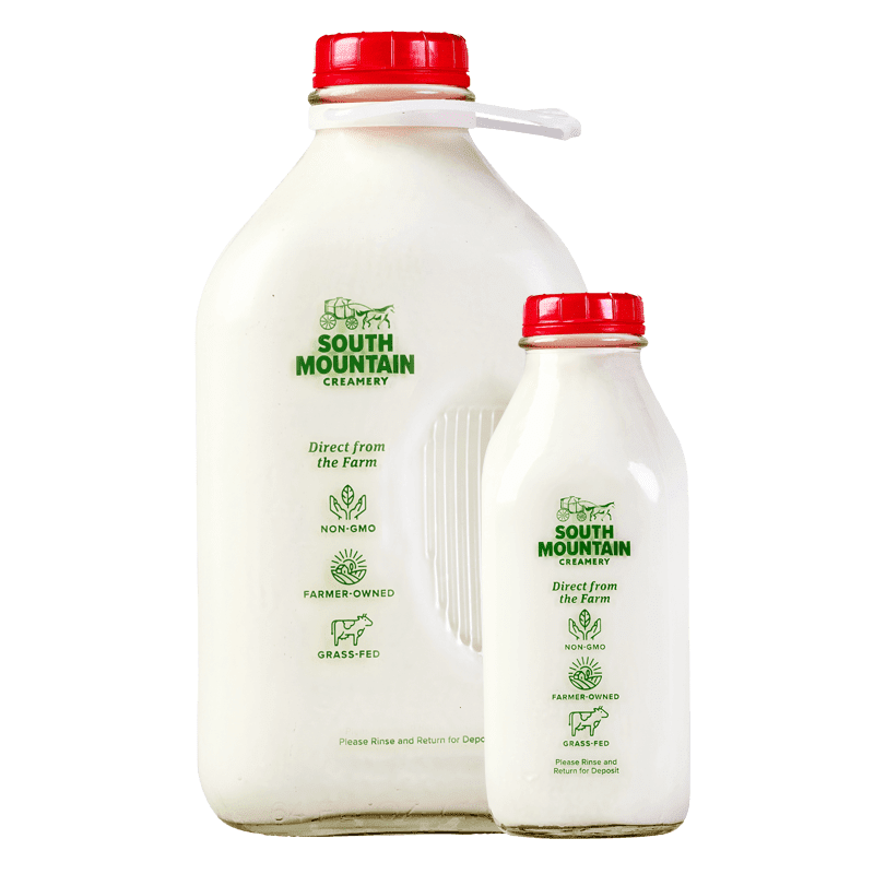 milk-white-bg two glass bottle of milk